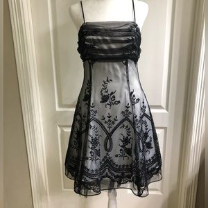 Gorgeous Dress with intricate details. Size M. Flattering and beautiful design.